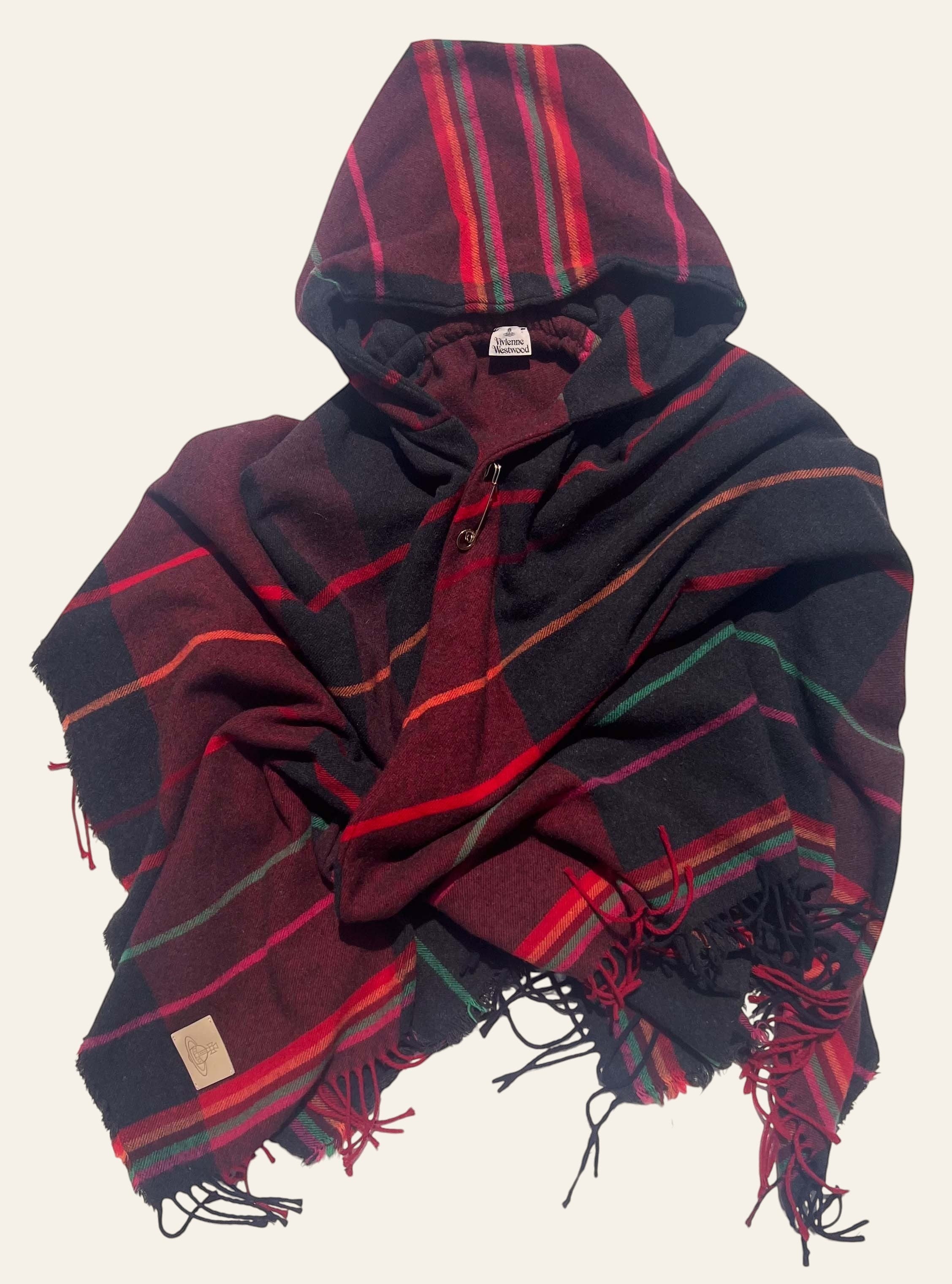 Lolly and Lotus Vivienne Westwood hooded tartan poncho in burgundy, black, and red with fringe and Orb patch detail.