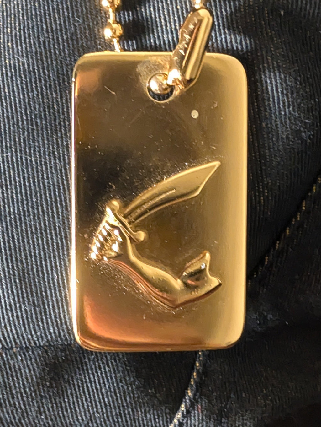 Lolly and Lotus Vivienne Westwood Anglomania trucker jacket featuring a gold arm and cutlass dog tag charm