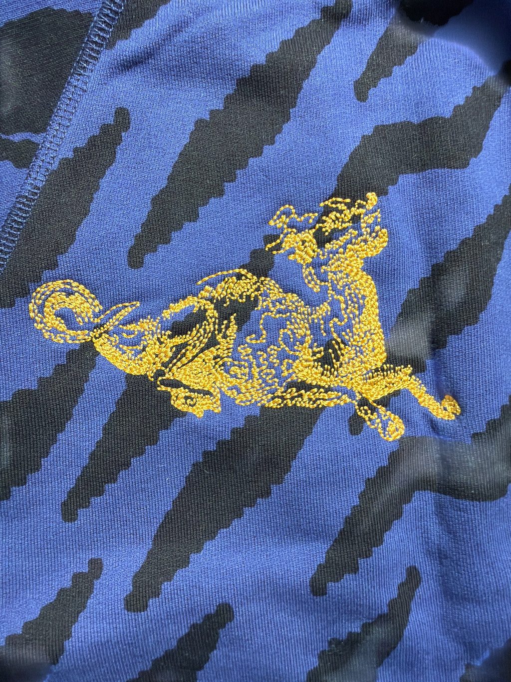 Lolly and Lotus Vivienne Westwood cropped jumper featuring a blue and black zebra print with yellow embroidered detail.