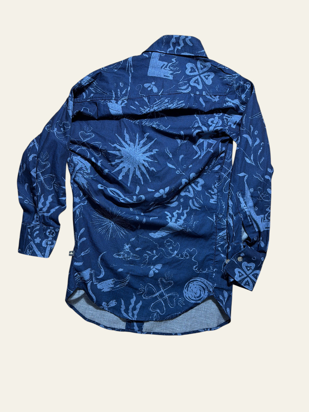 Vivienne Westwood Anglomania deconstructed blue denim long shirt with white graphic print.