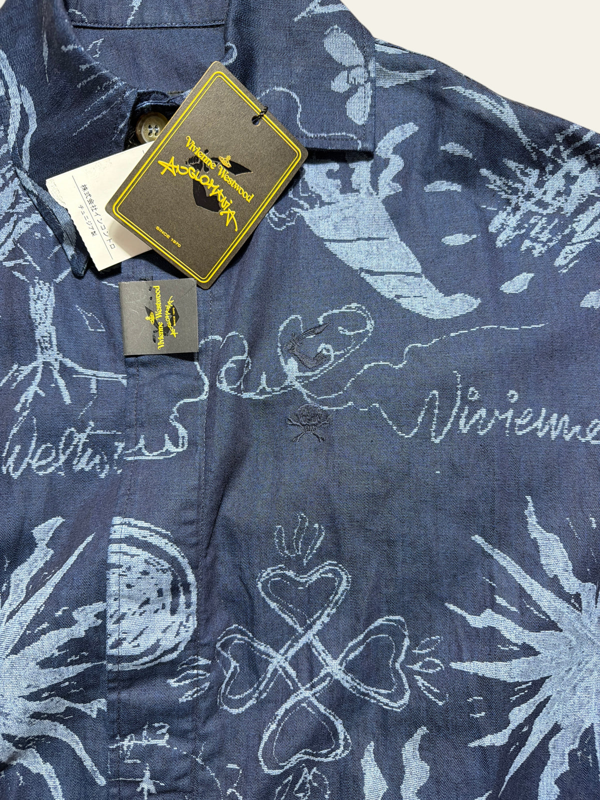 Vivienne Westwood Anglomania navy blue denim long shirt with white graphic print and brand tags.