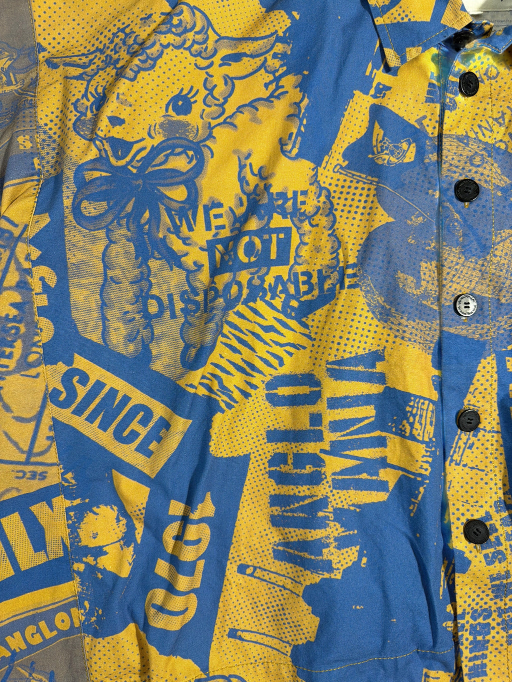 Vivienne Westwood Anglomania button-down shirt in blue and yellow with distressed graphic typography.