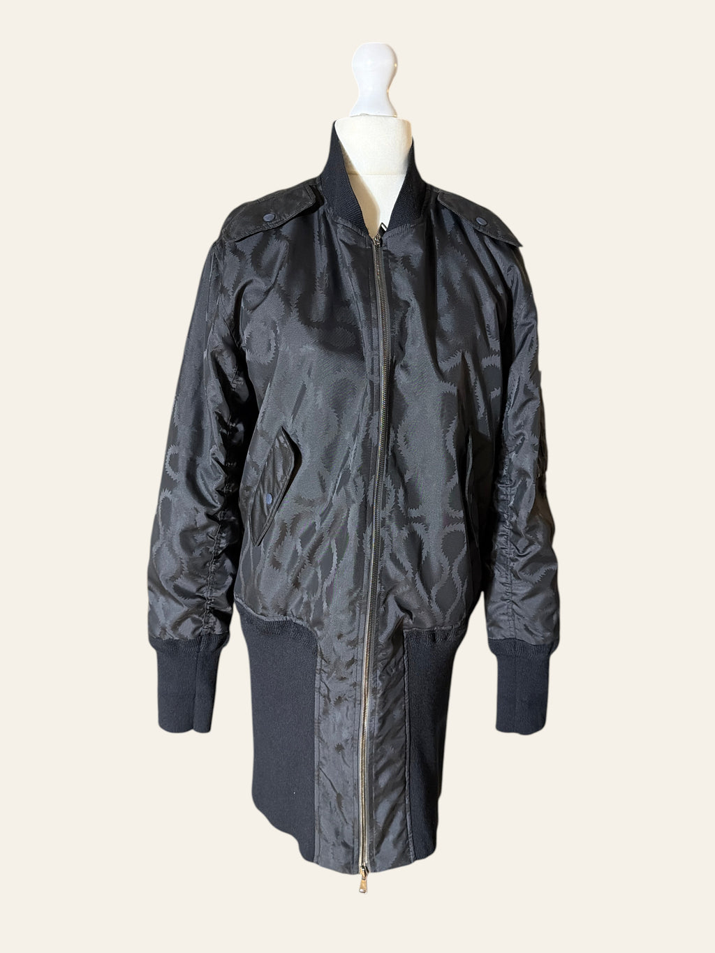 Vivienne Westwood MAN black tonal jacquard longline bomber jacket on a mannequin.