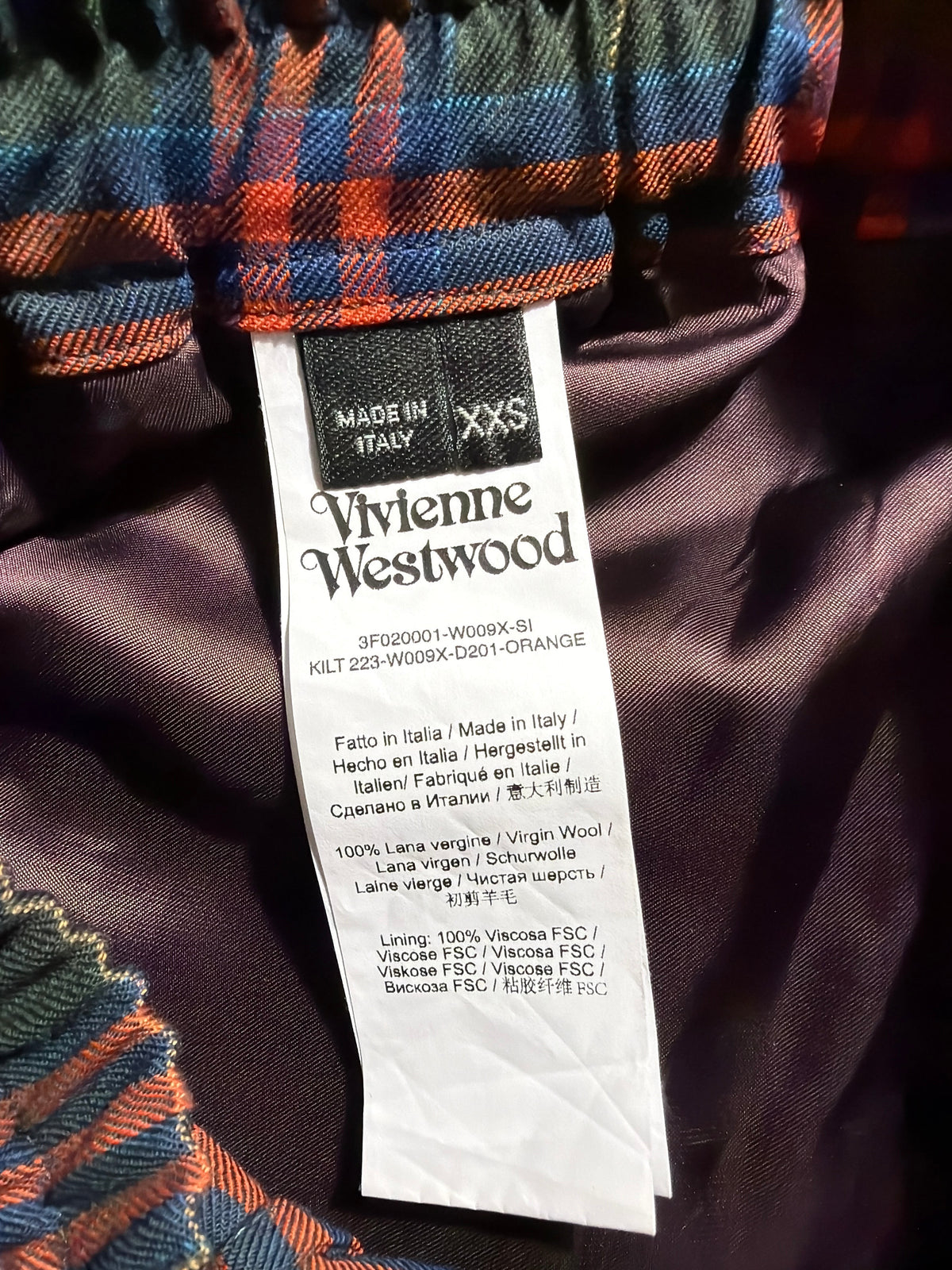 Vivienne Westwood tartan wool skirt interior label showing size XXS and Italian origin.